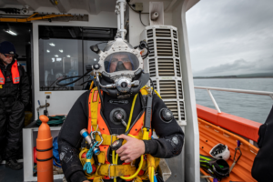 Diver on boat off the coast near sellafield